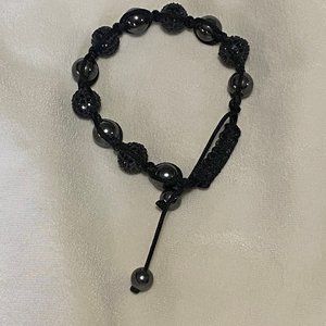 Elegant black beaded bracelet with crochet cord